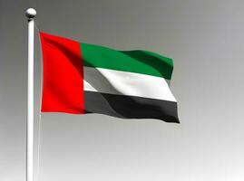 unido árabe emiratos nacional bandera ondulación en gris antecedentes foto