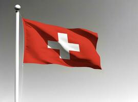 Switzerland national flag waving on gray background photo