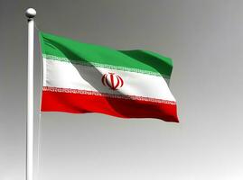 Iran national flag waving on gray background photo