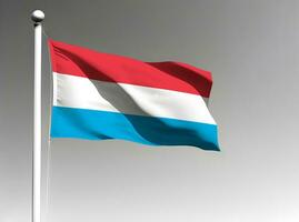 Luxembourg national flag waving on gray background photo