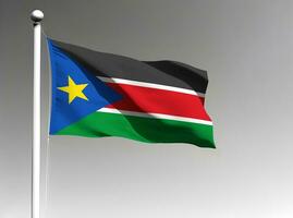 South Sudan national flag waving on gray background photo