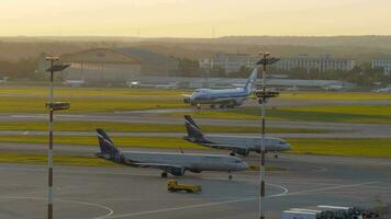 Driving planes in Sheremetyevo Airport at sunset, Moscow video