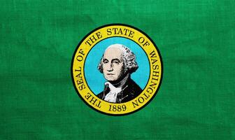 Flag of US state of Washington on a textured background. Concept collage. photo