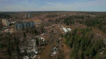 An aerial view of a residential wooded area on a bright day video