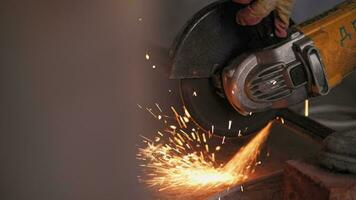 Metal is cut with a grinder, sparks fly. video