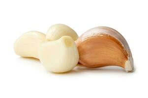 Front view of fresh garlic cloves in stack isolated on white background with clipping path Close up photo