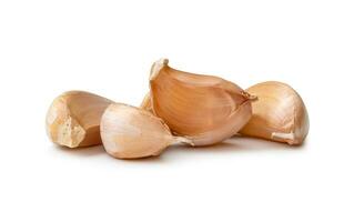 Front view of fresh garlic cloves in stack isolated on white background with clipping path Close up photo