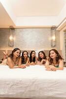 a group of Asian teenage girls are staying with their friends in a luxury hotel photo