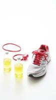 Conceptual health and lifestyle image with running shoes, water bottle, and a heart-shaped measuring tape symbol AI Generative photo