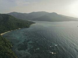 Aerial view of Karimunjawa Islands, Jepara, Indonesian archipelago, Volcano Island, coral reefs, white sand beaches. Top tourist destination, best diving snorkelling. photo