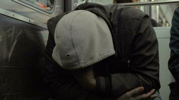 Homeless man dozing when traveling by metro train video