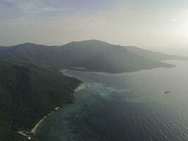 Aerial view of Karimunjawa Islands, Jepara, Indonesian archipelago, Volcano Island, coral reefs, white sand beaches. Top tourist destination, best diving snorkelling. photo