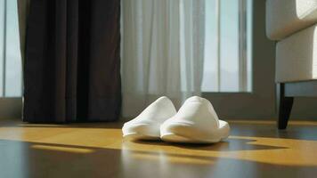 White slippers on a wooden floor video