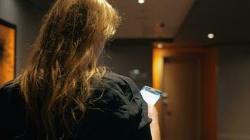 Woman typing message on the way to hotel room video