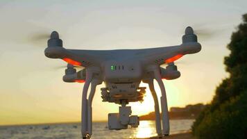 Drone flying near the sea at sunset video