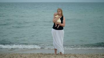 Mum hugging baby tight outdoor video