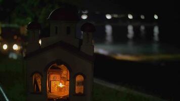 Miniature of Greek Orthodox church on sea-front at night video