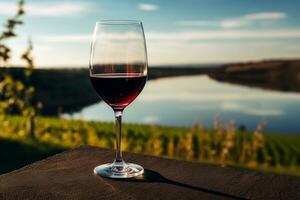 Close-up of Glass of Red Wine Reflecting Vineyard Landscape Offering Serene Ambiance AI Generative photo