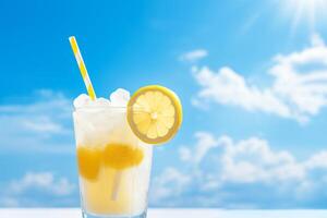 Bright Summer Image of Iced Lemonade in Glass with Lemon Slice and Straw photo