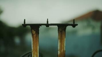 Blurred background of rusty iron fence posts. photo