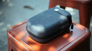 Close-up view of a mini travel pouch to accommodate electronic equipment. Can be used as a mockup. photo