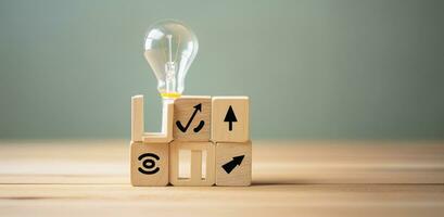 Creative idea, solution and innovation concept. Idea generation for business development. Wooden cube blocks with light bulb and cycle icons on clean background and copy space. AI Generative photo