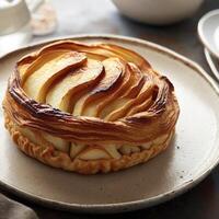 Upside down puff pastry apple tart on a breakfast plate. AI Generative photo