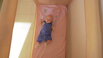 Quiet baby girl in playpen video