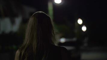 Woman walking alone in night street video