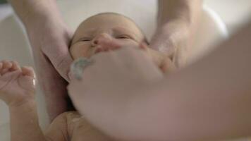 Newborn baby crying when bathing video