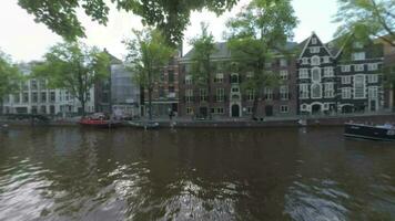 Amsterdam view with boats on the canal, Netherlands video