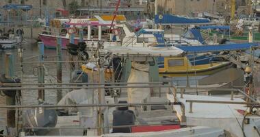 Tied up boats in the port of old Acre city, Israel video