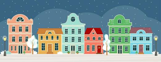 Street with cute colourful houses at winter night on Christmas eve. Traditional old european houses. Buildings front view. Winter town, city panorama. Vector illustration in flat style.