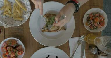 Woman having hearty meal in cafe video