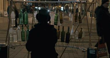 Street musician playing on glass bottles video