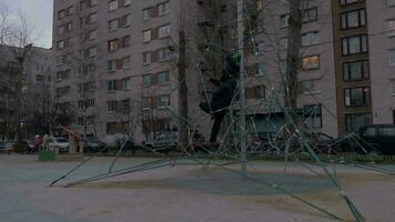 Children having fun with rope web climber on playground video