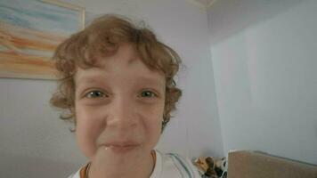 Portrait of funny little boy with curly hair video