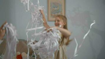 Happy girl dancing with paper confetti video