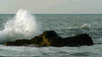 Rough sea crushing the rocks with high splashes video