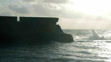 Ancient stone wall and wavy sea Acre, Israel video