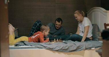 Child setting his own rules during chess play with mom video