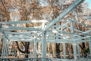 Close up white wooden gazebo house in park concept photo