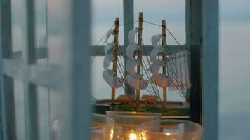 Outdoor lantern with ship model and candles video