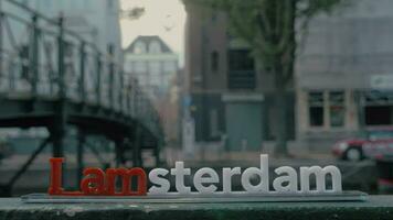 Amsterdam slogan on city background video