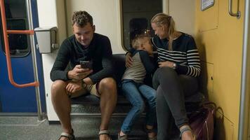 Timelapse of parents with son in underground train video