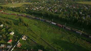 Cargo trains traveling in the countryside, Russia video