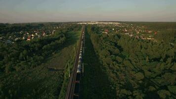 Train running in the village, aerial view video