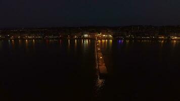 Aerial night view of resort and pier in the sea video