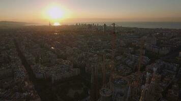 Flying over Barcelona and Sagrada Familia at sunset video
