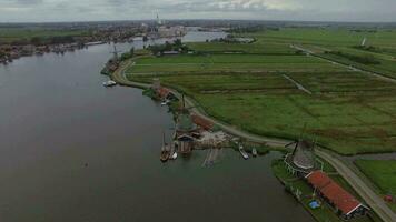 Rural scene with windmills and fields, aerial video